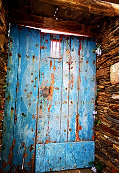 Old blue door in the village of Spain