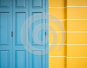 Old blue door and yellow wall