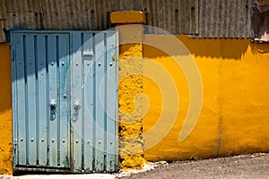 Old blue door and yellow wall at Ugakro cultural village in Incheon, Korea