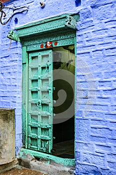 Old blue house with green door inside of Jaisalmer fortress, Jaisalmer, Rajasthan, India