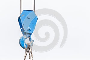 The old blue lifting crane hook is used in construction site on