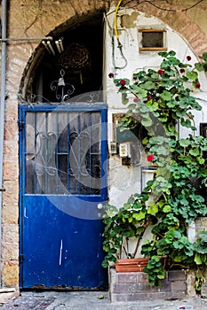 Old blue metal dirt door with keyhole and rusty metal lockas a beautiful vintage background