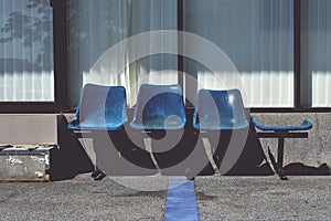Old blue plastic chairs for service recipients