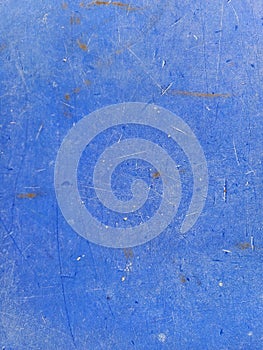 The old blue plastic surface, the blue with rough and scratched texture.