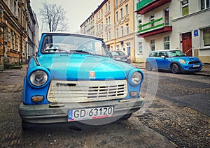Old blue plastic cheap car Trabant 601 parked