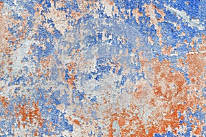 Old blue and red dirty shabby paint from the surface of the concrete wall texture with an abstract background pattern