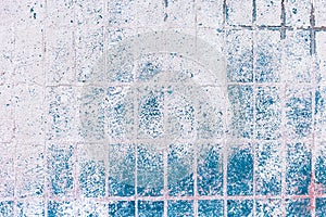 Old blue-white tile on the wall, rustic background