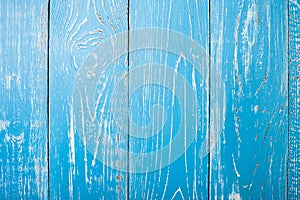 The old blue wood texture with natural patterns. Backgrounds concept - old wooden fence painted in blue background