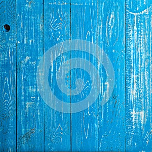 The old blue wood texture with natural patterns. Backgrounds concept - old wooden fence painted in blue background