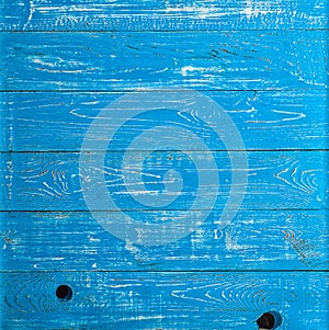 The old blue wood texture with natural patterns. Backgrounds concept - old wooden fence painted in blue background