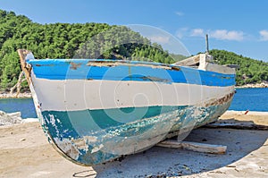 Old blue wooden shabby fishing boat