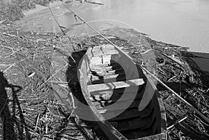 An old boat in the debris after the storm photo