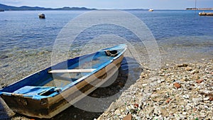 Old boat decaying on a beach