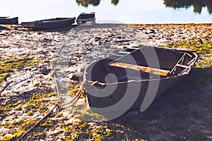 Old boat on the dirty shore