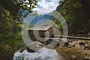 Old boat house at Lake Obersee in summer, Bavaria, Germany