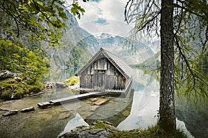 Old boat house at Lake Obersee in summer, Bavaria, Germany photo