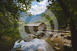 Old boat house at Lake Obersee in summer, Bavaria, Germany