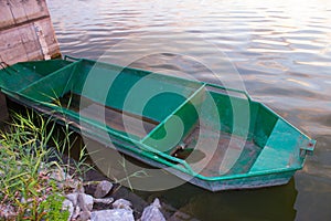 The old boat on the lake