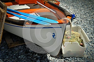 Old boat with oars on the sea shore