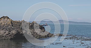 an old boat out in the ocean