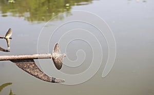 Old boat propeller with space on river background, outdoor day light