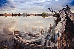 Old boat on the river Bank