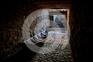 Old boat on stone paving. The concept of unfulfilled hopes, unfulfilled plans