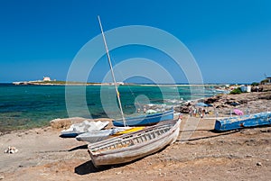 Old boats in the coastline of Portopalo (southern Sicily) photo