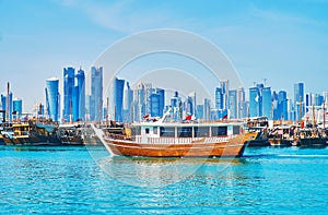 Old boats and modern buildings in Doha, Qatar