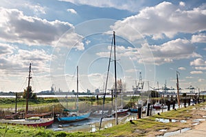 Old boats and modern harbor