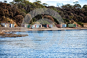 Old boatsheds on the shoreline at Opposum Bay along the Derwent River