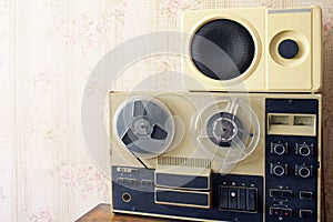 Old bobbin tape recorder on magnetic tape