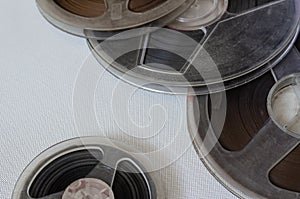 Old bobbins with audio recordings on a light background