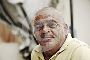 Old bold man with happy expression