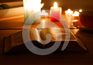 Old book in the candlelight