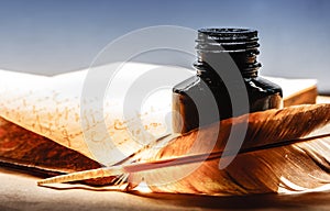 Old book with feather pen