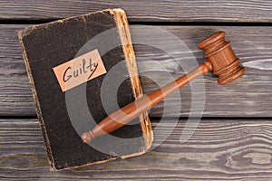 Old book gavel and guilty verdict.