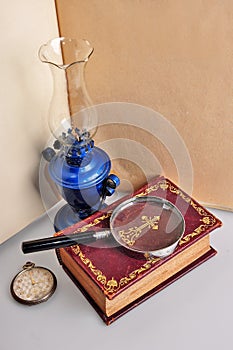 Old book lamp and watch