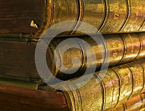 Old book in the light of candles