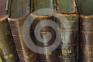 Old book in the light of candles