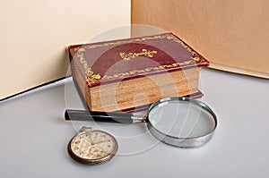 Old book magnifier and watch