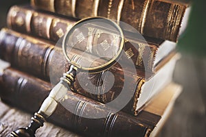 Old book and magnifying glass