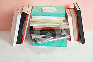 Old book shelf with stack of different books. Copy space