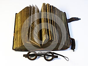 Old book and spectacles