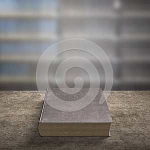 Old book on wooden table with blur bookshelfs background