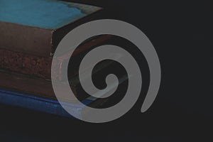 The old books arranged on a black background.