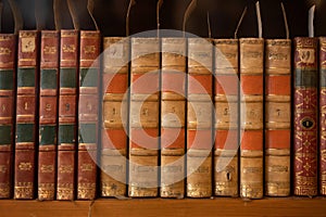 old books background, shelf with books, vintage editions