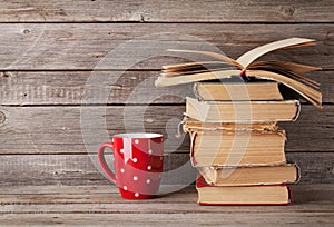 Old books and coffee cup