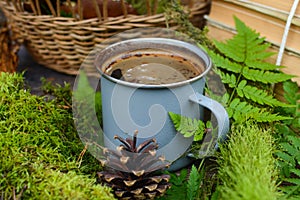 Old books and cup of coffee on dark wooden background