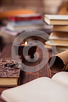 Old books,letter,diary and candle on wooden table